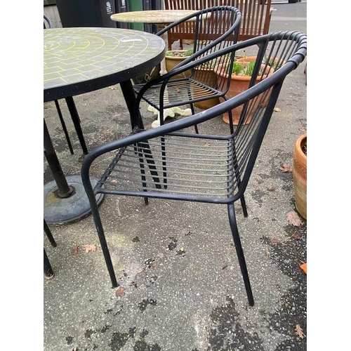 506 - Circular garden tile top table, four chairs and a parasol