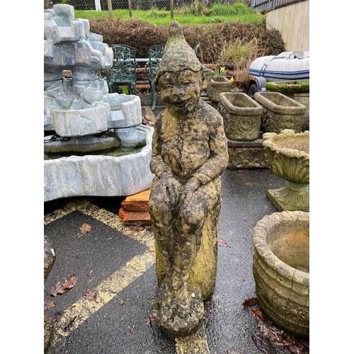 513 - Garden figure of an elf sitting on a log, approx 96cm tall