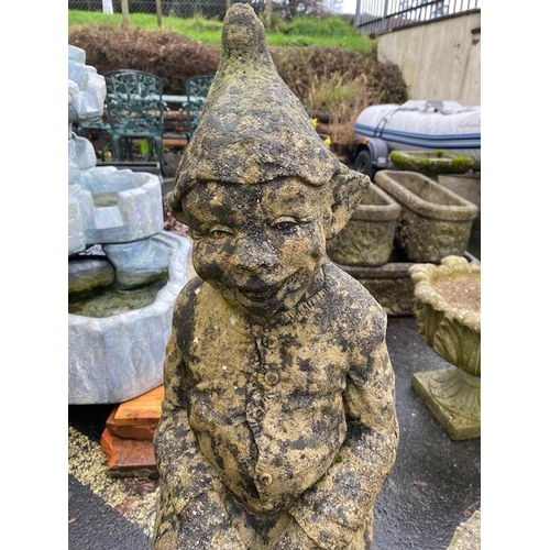 513 - Garden figure of an elf sitting on a log, approx 96cm tall