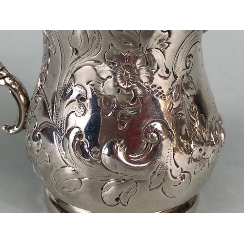 8 - Victorian Silver Hallmarked Cream Jug Birmingham 1877, decorated with repousse flora and foliage and... 