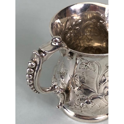 8 - Victorian Silver Hallmarked Cream Jug Birmingham 1877, decorated with repousse flora and foliage and... 