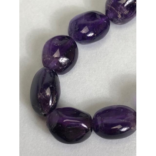 95 - Necklace of Amethyst pebble style stones approx 44cm in length