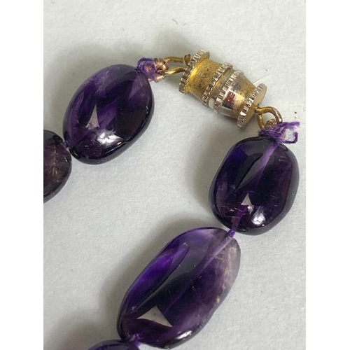 95 - Necklace of Amethyst pebble style stones approx 44cm in length