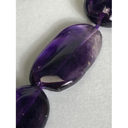 95 - Necklace of Amethyst pebble style stones approx 44cm in length