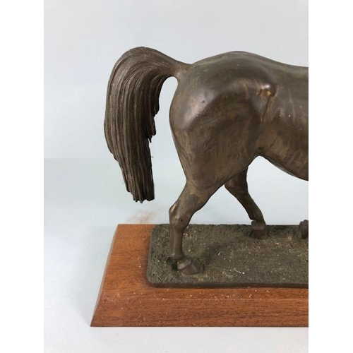 105 - Vintage Bronze finish cold cast metal statue of a horse on a wooden plinth, approximately 26 cm high