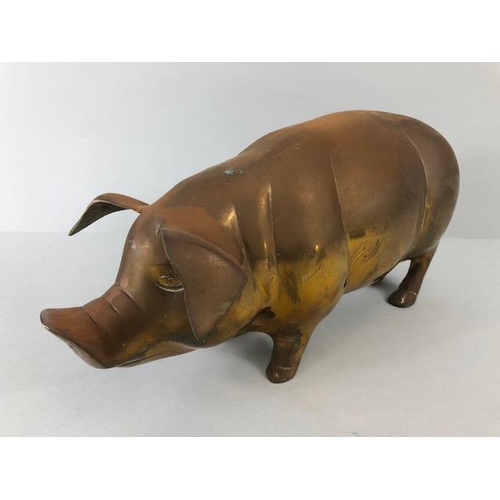 107 - Vintage whimsical figure of a pig in brass approximately 36 x 14cm along with a cold cast bronze of ... 