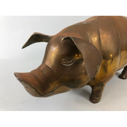 107 - Vintage whimsical figure of a pig in brass approximately 36 x 14cm along with a cold cast bronze of ... 