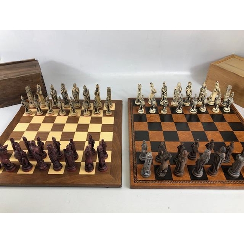 117 - Vintage Chess sets, two composite material Imperial roman chess sets in a wooden cases and Two chess... 