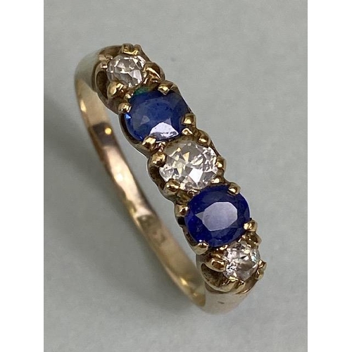 12 - 9ct yellow gold five stone ring set with two Sapphires and three diamonds in a liner setting approxi... 