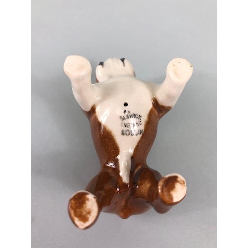 127 - Ceramic Bulldogs, four bulldog figures of varying size, one with Coppercraft trade label to base, on... 