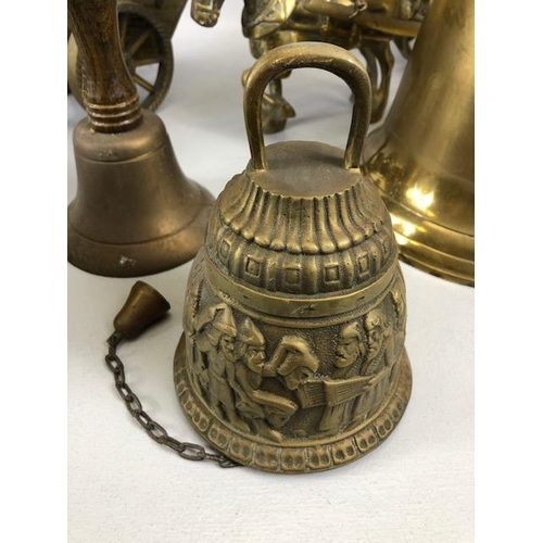 131 - Vintage Brass ware, to include a pair of heavy horses pulling carts and Four bells, (the larger with... 