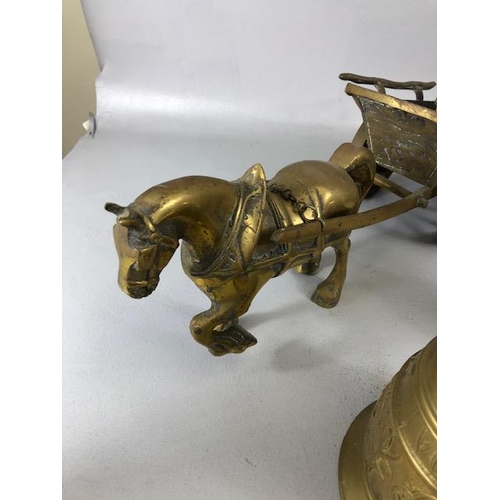 131 - Vintage Brass ware, to include a pair of heavy horses pulling carts and Four bells, (the larger with... 