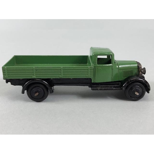 141 - Dinky Toys, 25A Bedford flat bed lorry in green with black hub caps and grill