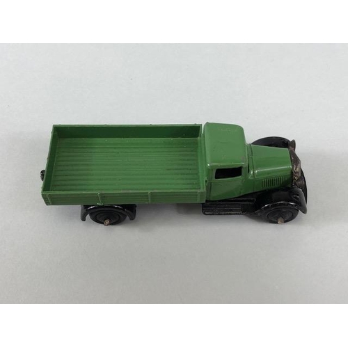 141 - Dinky Toys, 25A Bedford flat bed lorry in green with black hub caps and grill