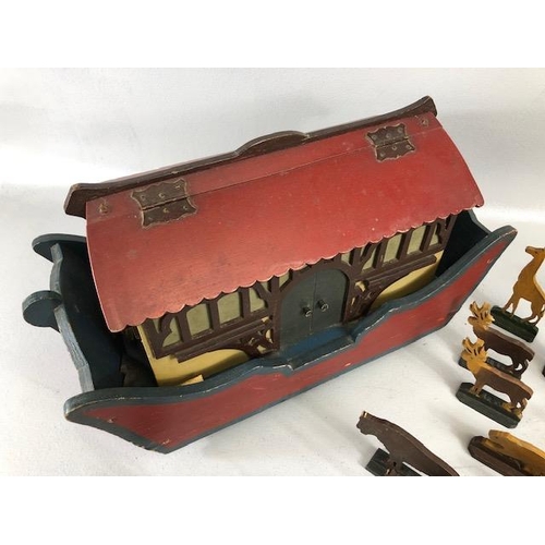 145 - Noah's Ark, early 20th century German flat bottom wooden ark on wheels with a collection of 31 cut o... 