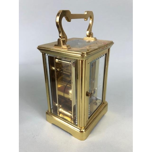 174 - Vintage carriage clock of brass with clear panels, white dial with roman numerals approximately 11cm... 