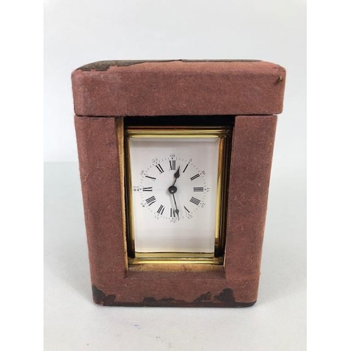 174 - Vintage carriage clock of brass with clear panels, white dial with roman numerals approximately 11cm... 