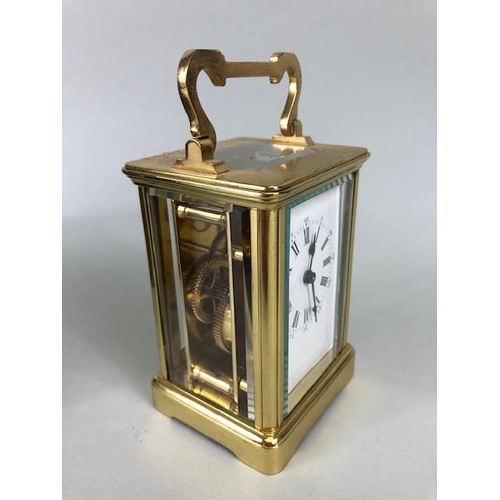 174 - Vintage carriage clock of brass with clear panels, white dial with roman numerals approximately 11cm... 