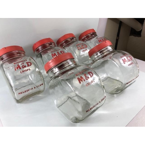 181 - Advertising interest, early 20th century Meredith & Drew glass shop storage jars with red composite ... 