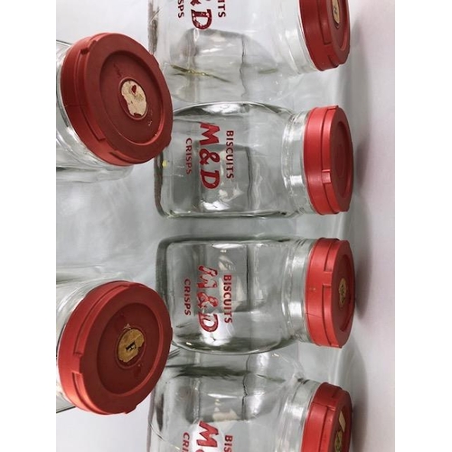 181 - Advertising interest, early 20th century Meredith & Drew glass shop storage jars with red composite ... 