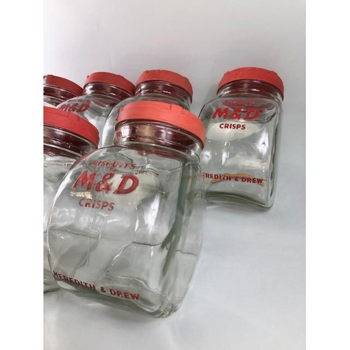 182 - Advertising interest, early 20th century Meredith & Drew glass shop storage jars with red composite ... 