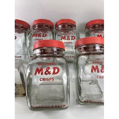 182 - Advertising interest, early 20th century Meredith & Drew glass shop storage jars with red composite ... 