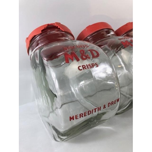 182 - Advertising interest, early 20th century Meredith & Drew glass shop storage jars with red composite ... 