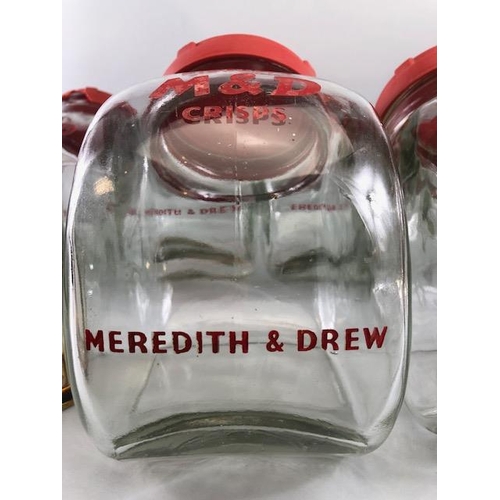 182 - Advertising interest, early 20th century Meredith & Drew glass shop storage jars with red composite ... 