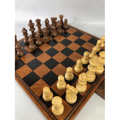 198 - Vintage chess sets, two boxwood chess sets with boards, one approximately 30 x 30cm the other 40 x 4... 