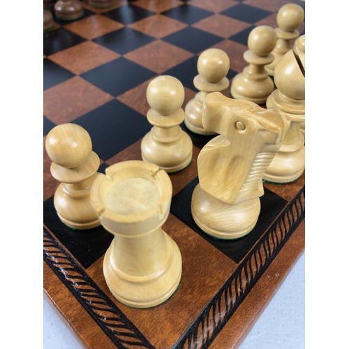 198 - Vintage chess sets, two boxwood chess sets with boards, one approximately 30 x 30cm the other 40 x 4... 