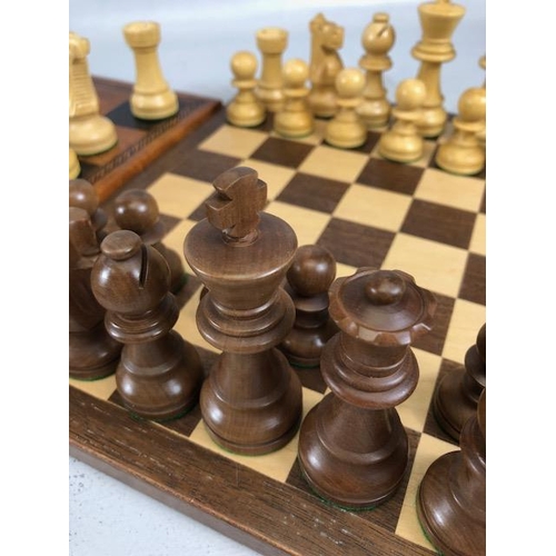 198 - Vintage chess sets, two boxwood chess sets with boards, one approximately 30 x 30cm the other 40 x 4... 