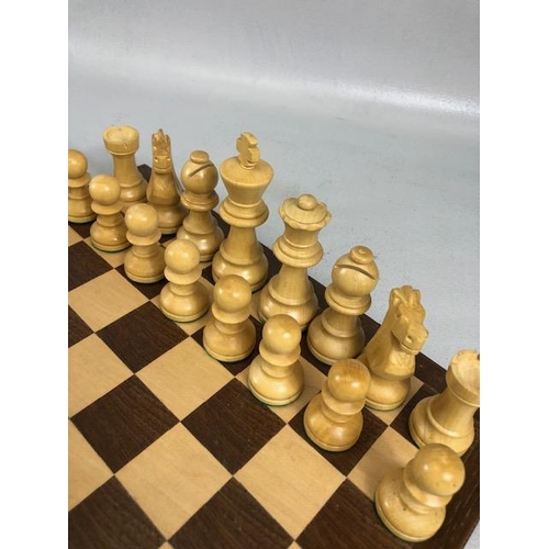 198 - Vintage chess sets, two boxwood chess sets with boards, one approximately 30 x 30cm the other 40 x 4... 