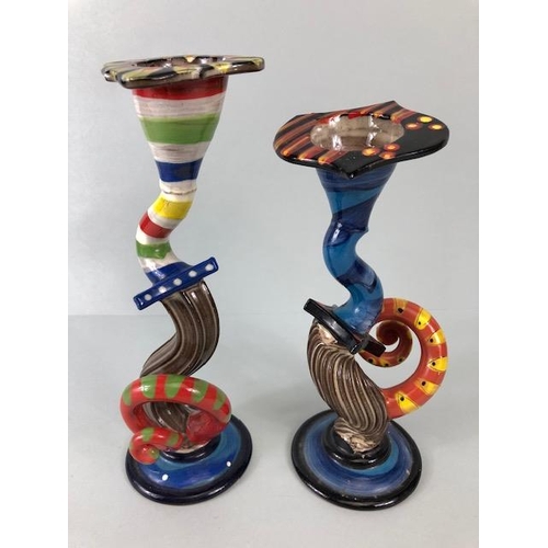 209 - Ross Emerson Art ceramics, being Two twisty candle sticks  in multi colour ways approximately 24 and... 