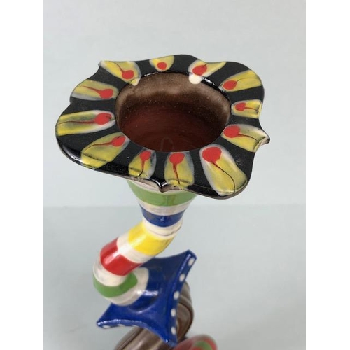 209 - Ross Emerson Art ceramics, being Two twisty candle sticks  in multi colour ways approximately 24 and... 