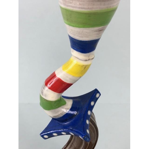 209 - Ross Emerson Art ceramics, being Two twisty candle sticks  in multi colour ways approximately 24 and... 