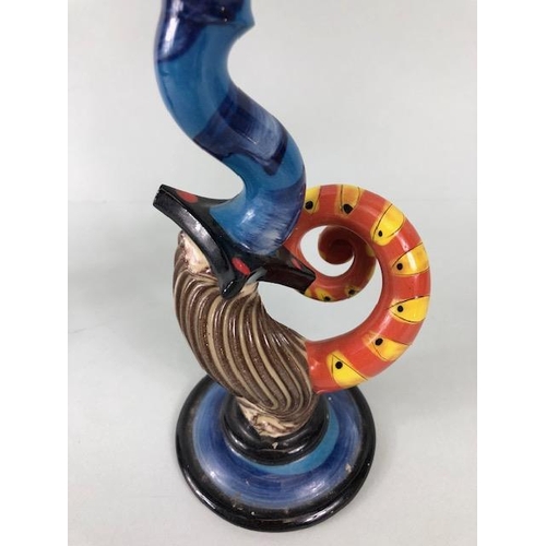 209 - Ross Emerson Art ceramics, being Two twisty candle sticks  in multi colour ways approximately 24 and... 