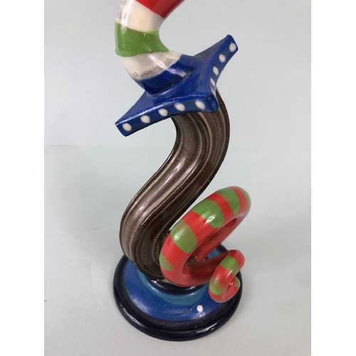 209 - Ross Emerson Art ceramics, being Two twisty candle sticks  in multi colour ways approximately 24 and... 