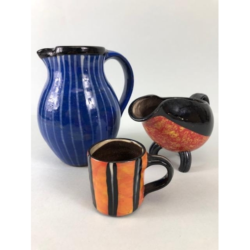 210 - Ross Emerson Art Ceramics, Blue striped jug approximately 16cm high, Tripod  sauce boat in orange, y... 