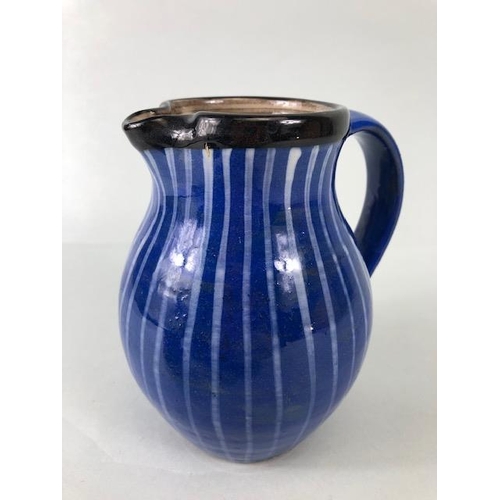 210 - Ross Emerson Art Ceramics, Blue striped jug approximately 16cm high, Tripod  sauce boat in orange, y... 