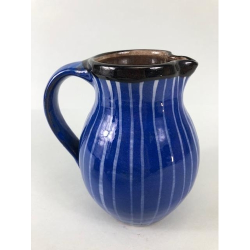 210 - Ross Emerson Art Ceramics, Blue striped jug approximately 16cm high, Tripod  sauce boat in orange, y... 