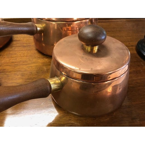 217 - Vintage Retro mid century set of Copper pans with teak handles, comprising three sauce pans and one ... 