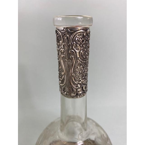 24 - Silver marked 800 continental Glass and silver decanter, the silver repousse in an Art Nouveau style