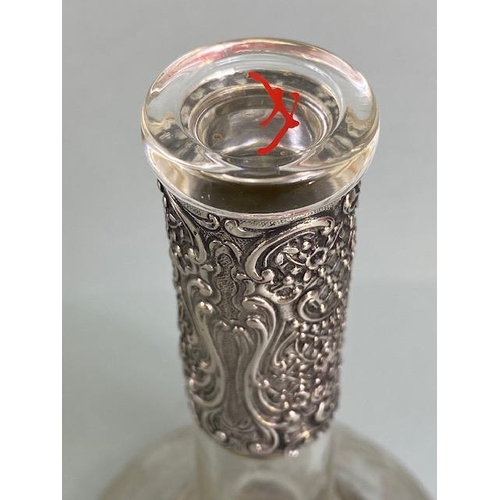 24 - Silver marked 800 continental Glass and silver decanter, the silver repousse in an Art Nouveau style