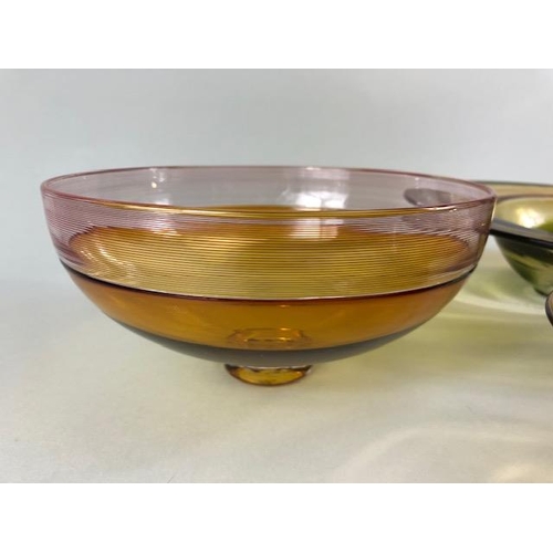 245 - Art Studio glass, Three amber glass bowls all with ground bases one with a signature