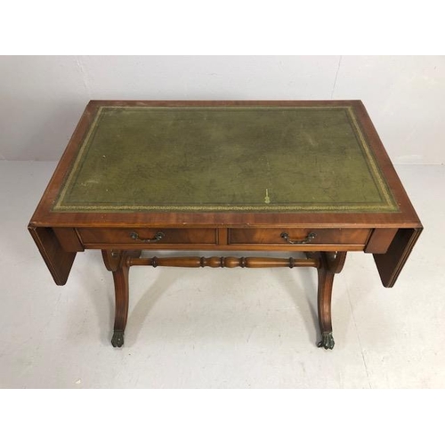 262 - Reproduction regency style side table, leather insert top with drop down leaves supported at the sid... 