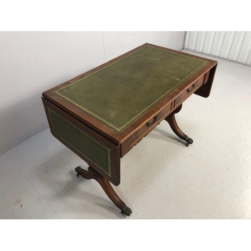 262 - Reproduction regency style side table, leather insert top with drop down leaves supported at the sid... 