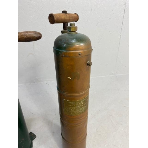 277 - Decorators interest, two antique hand extinguisher pumps, one copper the other metal, with copper an... 