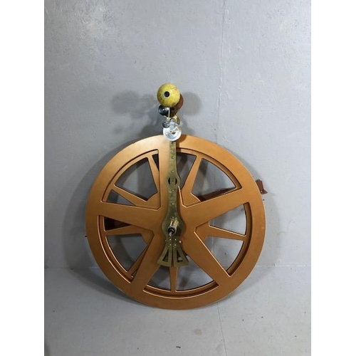 283 - Decorators / Shop display interest, two oversized wheel cogs of composite board with a planetarium s... 