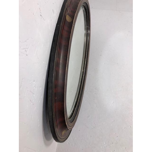 301 - Antique mirror early 19th century oval  bevel glass mirror in flame mahogany and ebonised frame with... 