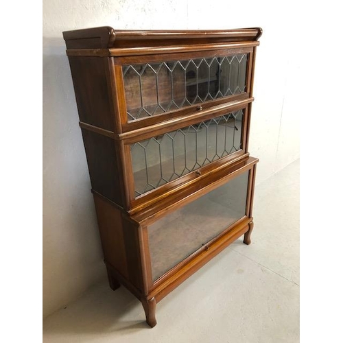 306 - Three section Globe Wernicke bookcase with two leaded glazed panel doors, the lower stepped case wit... 